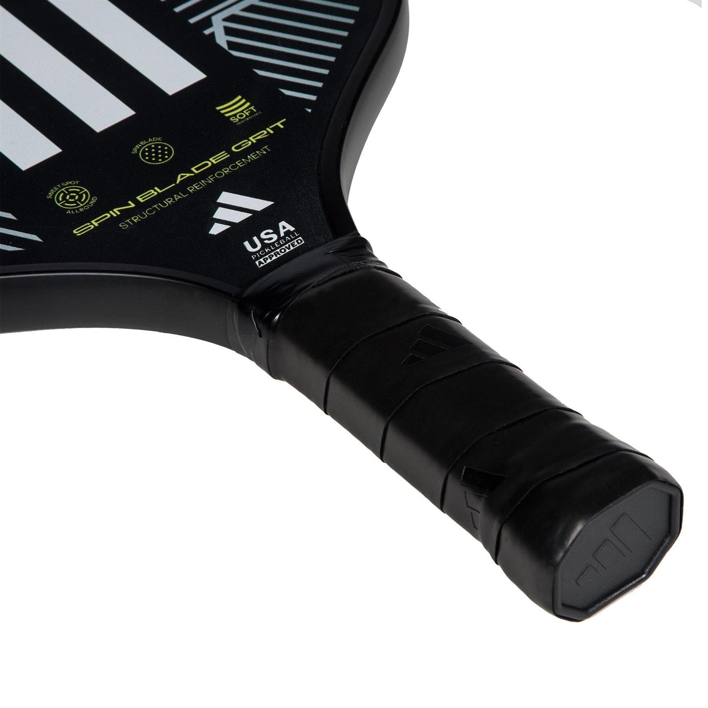 Close-up of the handle and lower part of the black adidas Match 3.3 Pickleball Paddle featuring a wrapped grip, white diagonal stripes, and visible "USA Pickleball Approved" and "Spin Blade Grit" text on the face.
