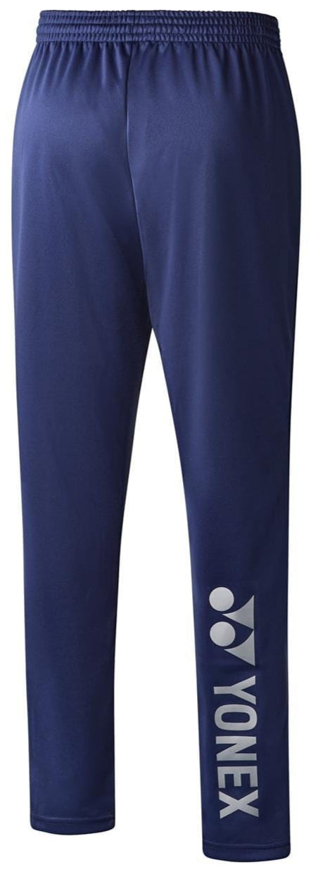 Introducing the Yonex YTP123 Unisex Tennis Tracksuit Pants in Navy. These pants feature an elastic waistband and tailored tapered legs, adorned with the distinctive white Yonex logo on the lower left leg. Crafted from quick-drying, sweat-absorbent material, they are elegantly presented against a plain white background.