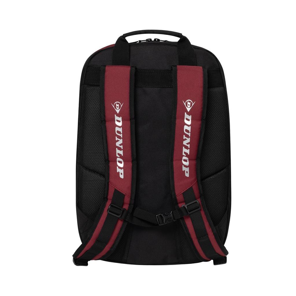 Introducing the Dunlop CX Performance Tennis Backpack in Black and Red. This sleek backpack features red and black straps and prominently displays "DUNLOP" in white lettering. Crafted for the CX Performance line, it provides a streamlined appearance with padded sections for comfortable racket transport.