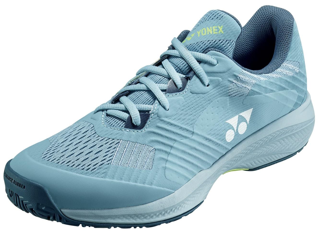 The Yonex Power Cushion Sonicage WIDE 2025 Men's Tennis Shoes are grayish blue athletic shoes featuring light blue laces and the Yonex logo. With a textured sole and Power Cushion technology, these lightweight shoes are ideal for sports and casual wear.