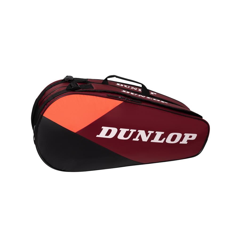 The Dunlop CX Club 6 Tennis Racket Bag – Black/Red, from Dunlop, showcases a stunning black and red design. This roomy bag includes a convenient top handle and side pocket, making it an ideal choice for transporting all your essential tennis gear.