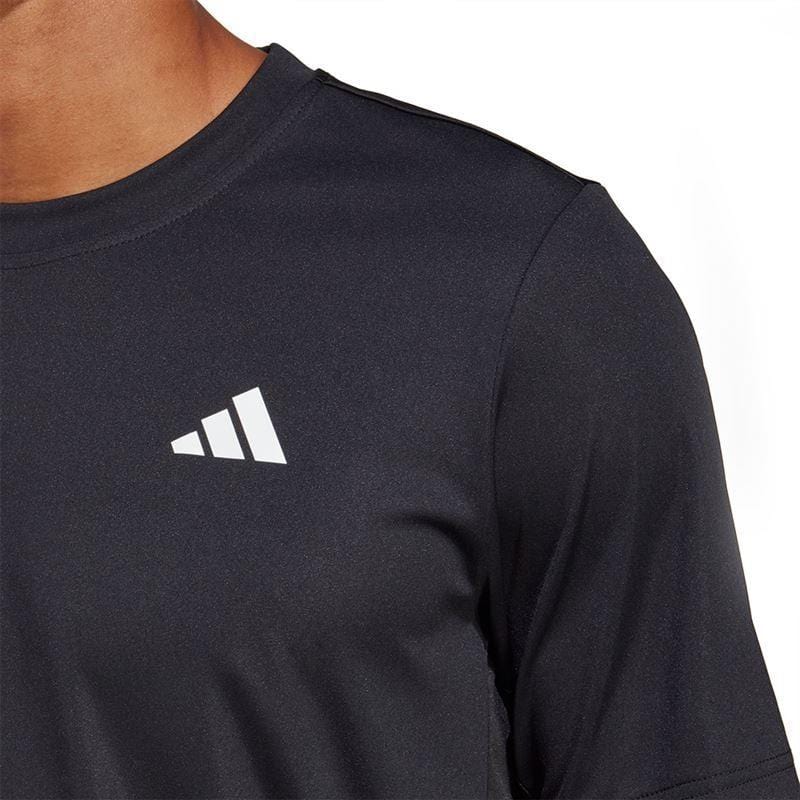 A person wearing an adidas men's Club Tennis T-Shirt in black, made with AEROREADY fabric, featuring a white geometric logo on the chest. Only the upper part of the body is visible against a white background.