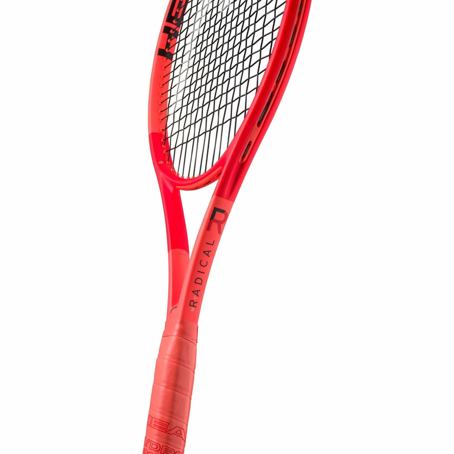 Close-up of the HEAD Radical MP 2025 Tennis Racket in orange, featuring "RADICAL" on the throat. Black strings and a red grip enhance its sleek frame, crafted for all-court performance.