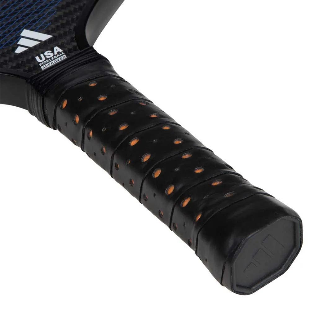 Close-up of the adidas ADIDAS Adipower Carbon CTRL 3.3 Pickleball Paddle in Black/Blue, showing its black perforated grip and hexagonal end cap. Made for advanced players, with a textured surface and USA Pickleball Approved label by the grip.