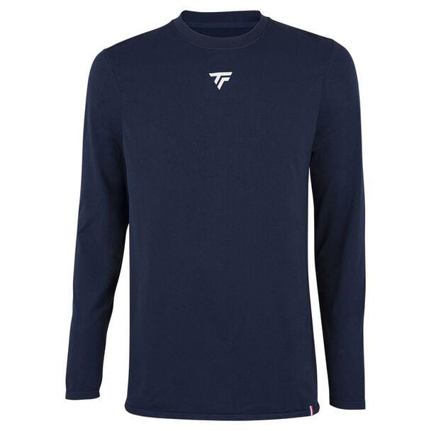 The Tecnifibre Men's Tennis Seamless Baselayer in Marine is displayed against a white background, ideal for cold-weather sportswear. It includes a small white logo on the chest, a tiny red, white, and blue tag at the bottom hem, and is crafted with perspiration-wicking fabric to keep you dry and comfortable.