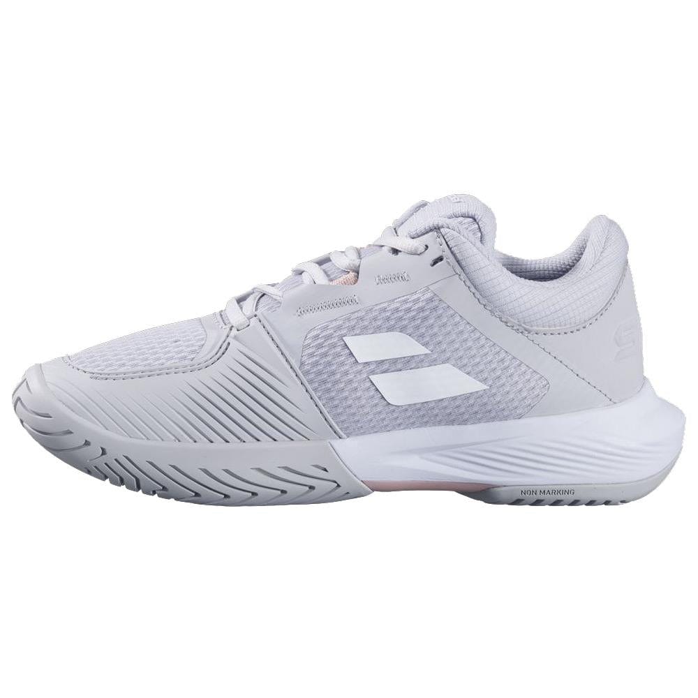 The Babolat SFX 4 All Court 2025 Women's Tennis Shoes in Lunar Rock feature a textured design with ventilated mesh panels, a white Michelin Original rubber sole, and lace-up closure, highlighted by branding on the side and tongue.