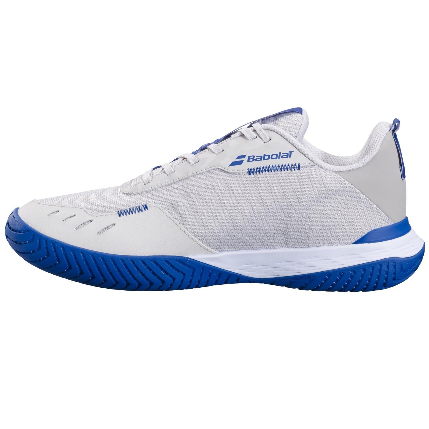 The Babolat SFX Evo 2024 All Court Men's Tennis Shoes in oatmeal are highlighted for their exceptional comfort. These shoes showcase a mesh upper that promotes breathability, complemented by a secure lace-up closure. The blue rubber outsole is designed with a herringbone tread pattern to provide optimal flexibility on the court, and the Babolat logo is prominently featured on the side.