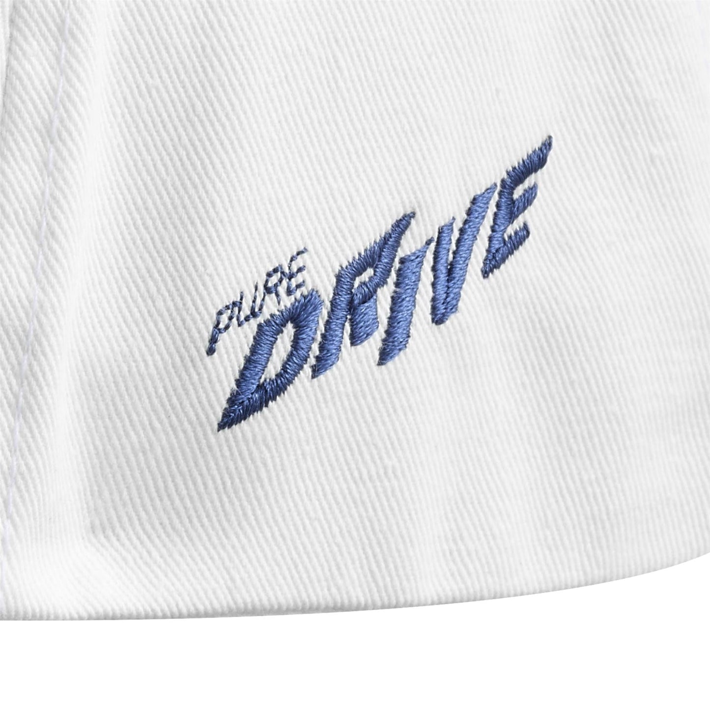 Close-up of a Babolat Pure Drive Cotton Cap in white, featuring "PURE DRIVE" embroidered in bold, slanted Drive Blue thread on recycled cotton fabric, highlighting the textured detail.