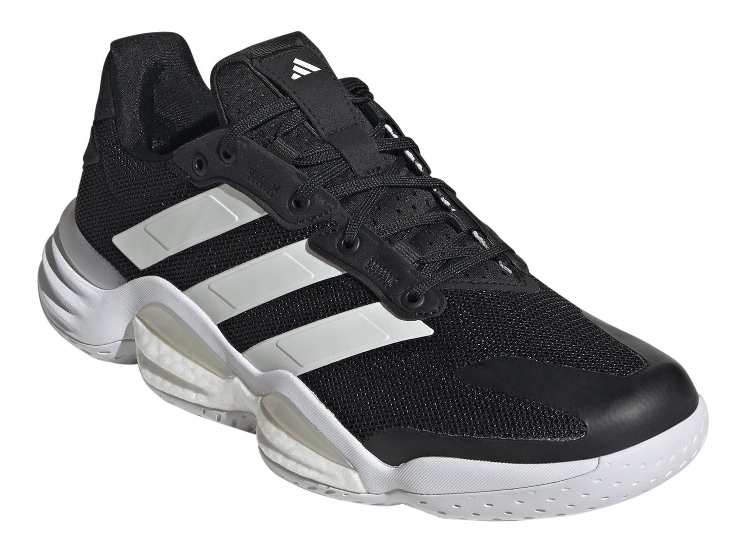 The ADIDAS Stabil 16 Men's Indoor Court Shoes in black feature a textured upper, BOOST midsole, three white stripes, a wavy sole design, and sleek black laces for an athletic look.
