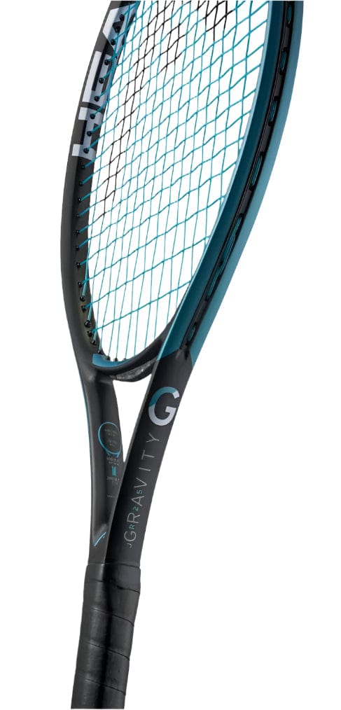 A close-up of the HEAD Gravity Junior 25 2025 Tennis Racket - Black highlights its sleek, modern design with a black and turquoise frame. Featuring Graphene Inside technology, the blue strings spell "GRAVITY," while the black grip enhances its contemporary look.