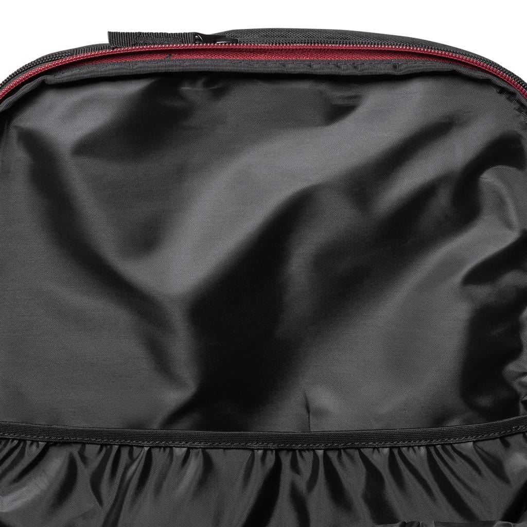 A close-up view of the Dunlop CX Performance Tennis Backpack in black with red accents showcases its sleek design. The smooth surface is complemented by a red zipper running along the top edge. The lower section boasts gathered material for a textured appearance, perfect for holding tennis rackets. Ideal for athletes prioritizing high performance.