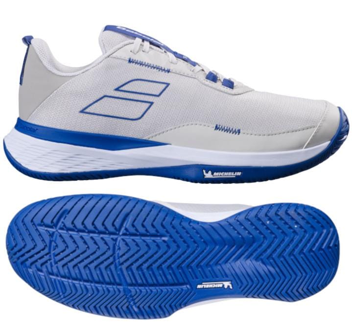 Introducing the Babolat SFX Evo 2024 All Court Men's Tennis Shoes in Oatmeal. These tennis shoes feature a sleek design prioritizing unmatched comfort and flexibility. The upper showcases an oatmeal hue enhanced by blue accents, while the sole exhibits a stylish blue tread pattern. The distinguished Babolat logo is prominently displayed on the side and sole for added flair.