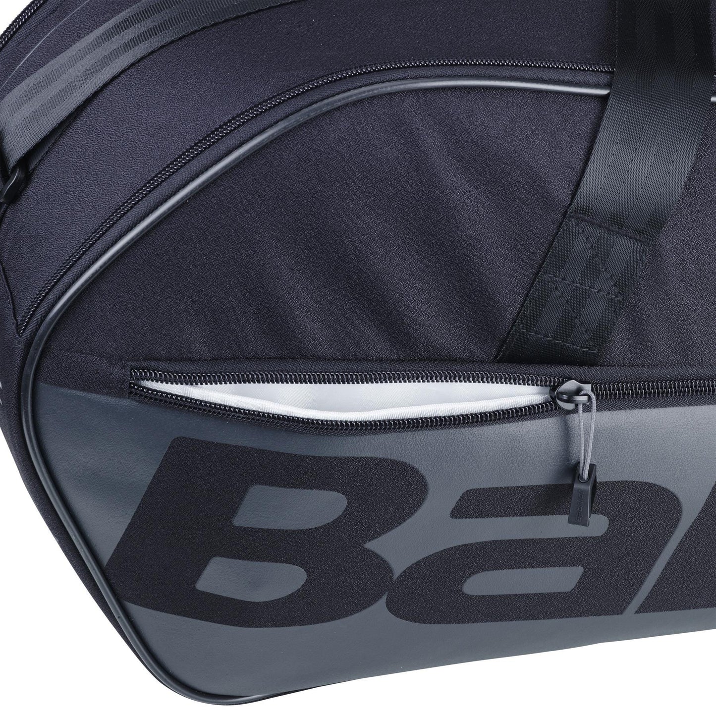Close-up of a Babolat Court M 6 Racket Tennis Bag in black, crafted from 100% recycled PET. It highlights a visible zippered pocket and bold Babolat branding—ideal for organizing your tennis gear.
