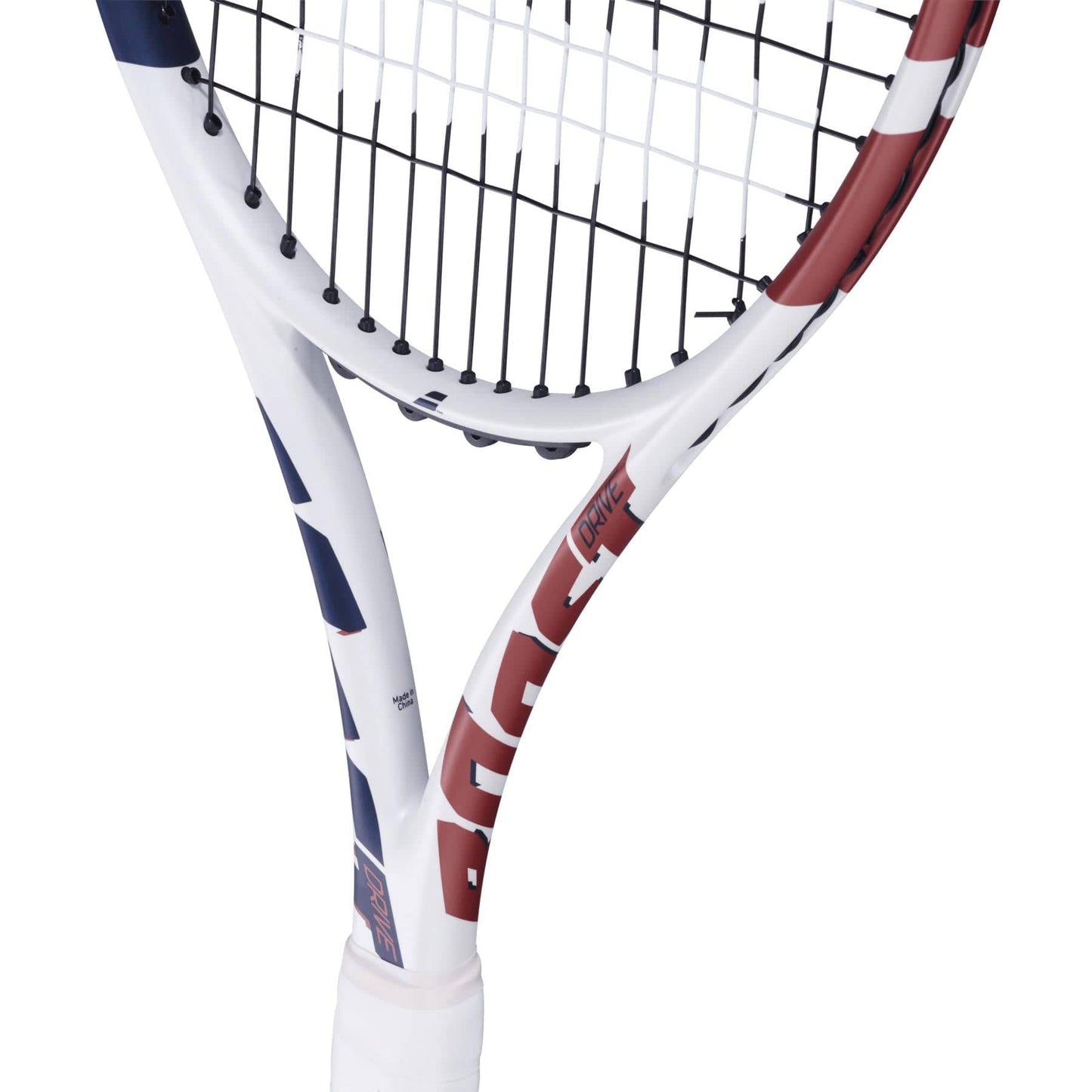 Close-up of the Babolat Boost Drive Tennis Racket - White by Babolat, showcasing its lightweight graphite frame with a white design and red-blue accents. The grid-patterned strings and partially visible Woofer System logo on the throat are also featured.