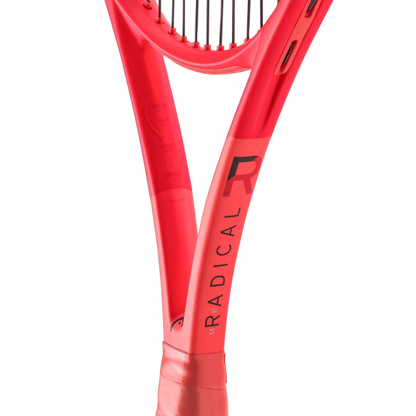 Close-up of the HEAD Radical MP 2025 Tennis Racket's throat section, highlighting its strings and stylized "R" branding. The sleek orange design, featuring Auxetic 2.0 technology, underscores the racket's all-court performance attributes.