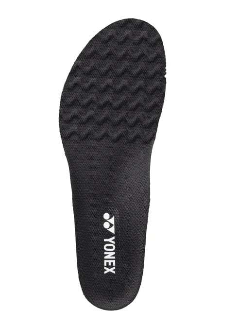 The Yonex AC196 Power Cushion Agility Insole in black boasts a textured surface with a wavy pattern for enhanced grip and features the brand's white logo. It is equipped with Power Cushion technology to boost your performance on the court.