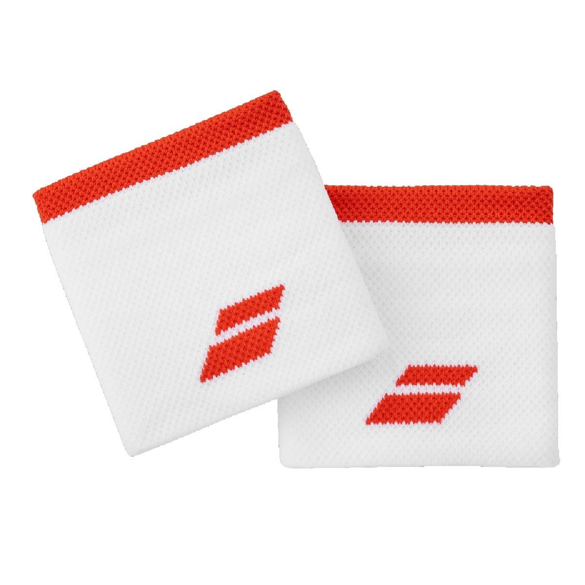 Two Babolat Logo Wristbands in White and Fiesta Red, crafted from high-absorption terry material, display a bold red Babolat logo and red trimming. They are arranged diagonally side by side on a plain white background.