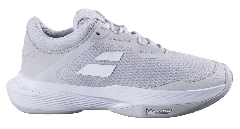 The Babolat SFX 4 All Court 2025 Women's Tennis Shoes - Lunar Rock feature a side view with a light gray textured mesh upper, thick white sole for optimal traction, branding on the side, logos on heel and sole, plus reinforced stitching to ensure durability and comfort.