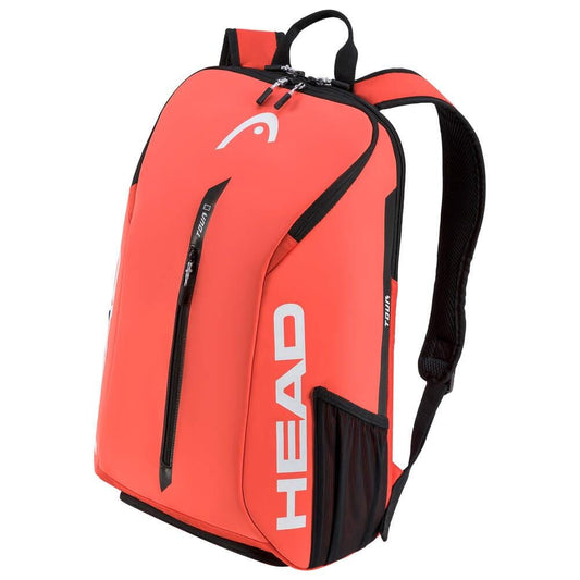 A fluorescent orange HEAD Tour Tennis Backpack with prominent white branding showcases a sleek, modern design. It includes multiple zippered compartments, featuring a dedicated shoe space and a special racket compartment. The black shoulder straps and top handle enhance its sporty appeal.