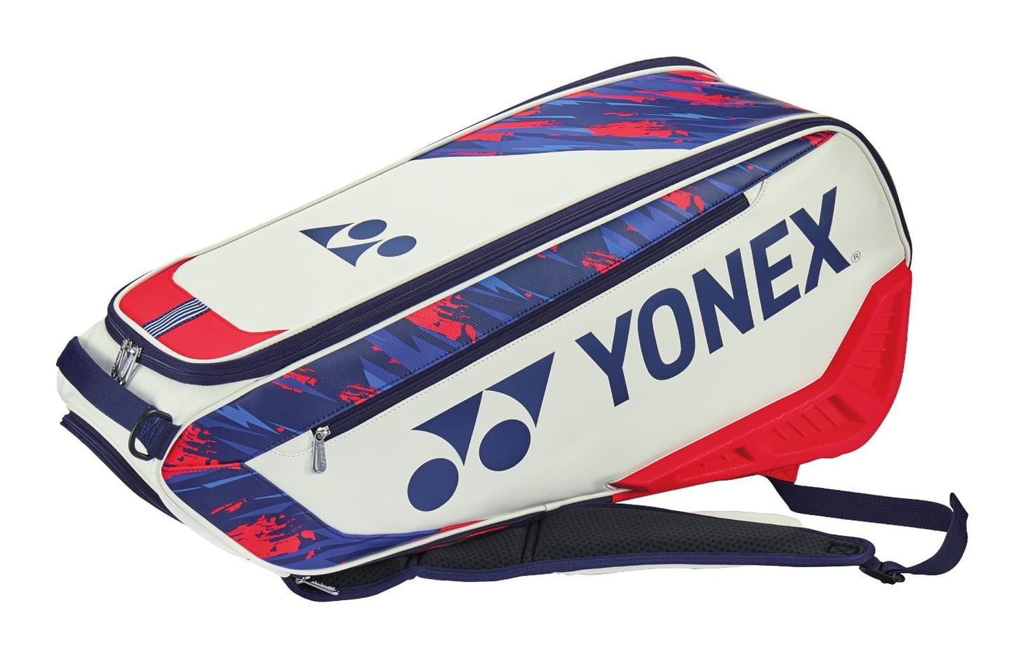 The Yonex 02326EX 2024 Expert 6 Racket Tennis Bag showcases a dynamic red and white design adorned with the renowned Yonex logo. Ideal for storing tennis gear, it includes numerous zippered compartments and an adjustable shoulder strap for convenient carrying.