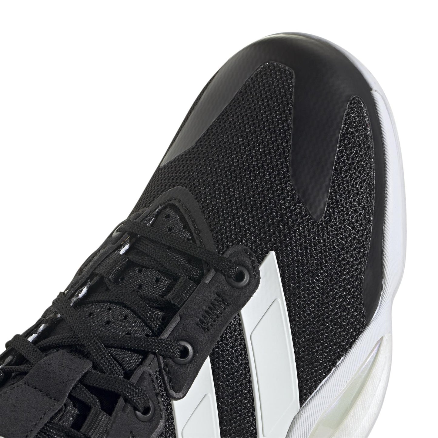 Close-up of an ADIDAS Stabil 16 indoor court shoe, showcasing its sleek, modern design with white stripes on a textured black mesh. It features black laces and a slightly transparent white BOOST midsole—perfect for a stylish athletic look.