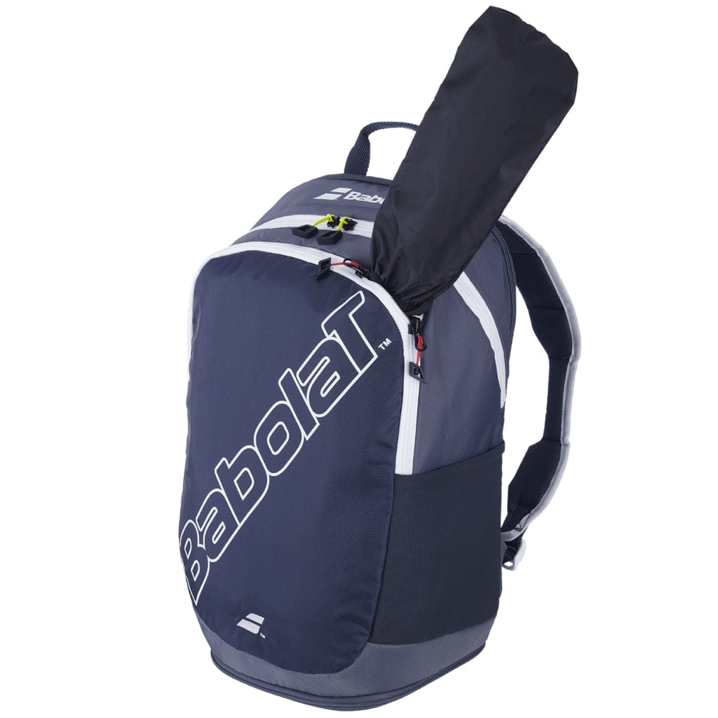 The Babolat Evo Court Tennis Backpack in grey and blue is crafted from eco-friendly materials, offering dedicated racket storage with the handle partially visible. It also features multiple zippered sections and padded shoulder straps for enhanced comfort.