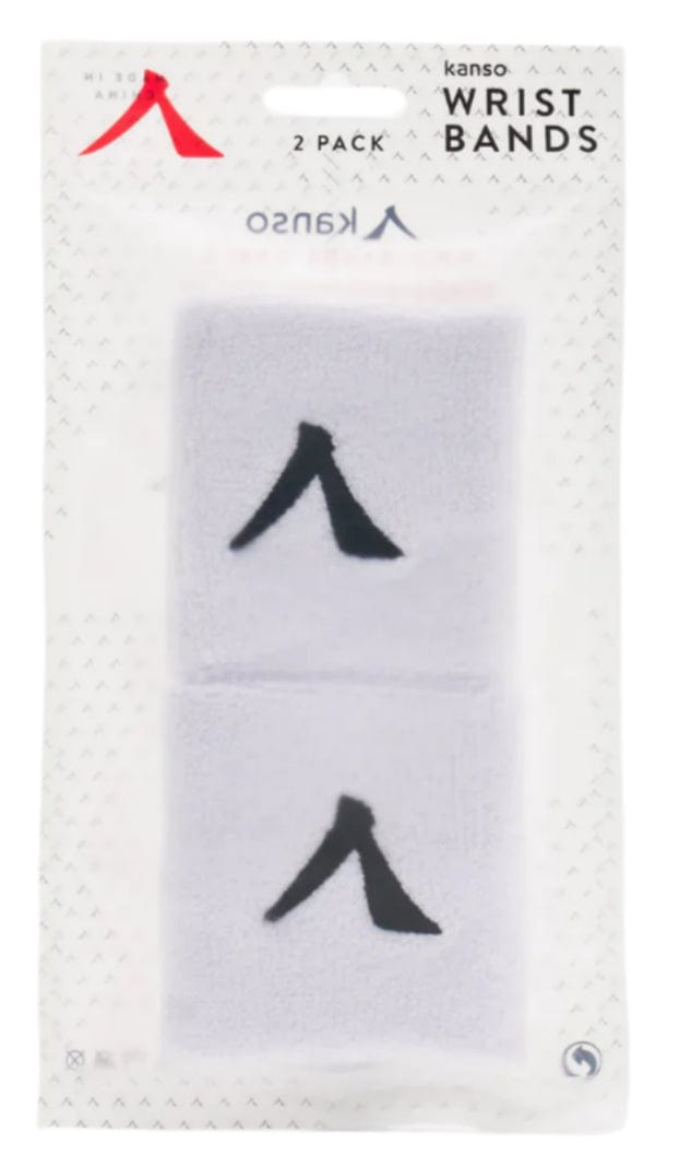 The image displays a Kanso 7cm Wristband - 2 Pack - White. Two absorbent white bands feature a black "A" logo. The packaging is clear, with small perforations and the label "Kanso 7cm Wristband - 2 Pack.