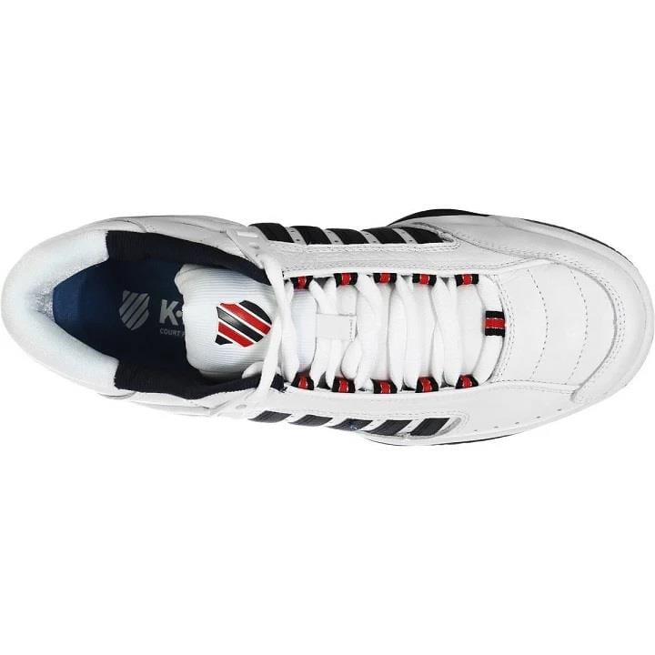 Top view of the K-Swiss Defier RS Men's Tennis Shoes in white, dress blue, and fiery red accents. These sneakers offer exceptional stability and feature a white tongue with dress blue stripes along the sides, showcasing branding on the insole. The lace-up design guarantees durability for everyday wear.