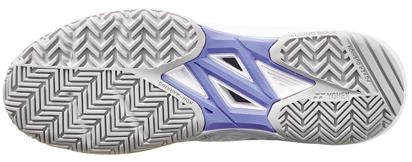 Close-up of Yonex Power Cushion Sonicage 2025 women's tennis shoe sole, with a zigzag tread pattern for grip. The mostly white sole features grey accents, textured grooves for traction, and is labeled "Yonex" and "POWER CUSHION," providing excellent cushioning and support on the court.