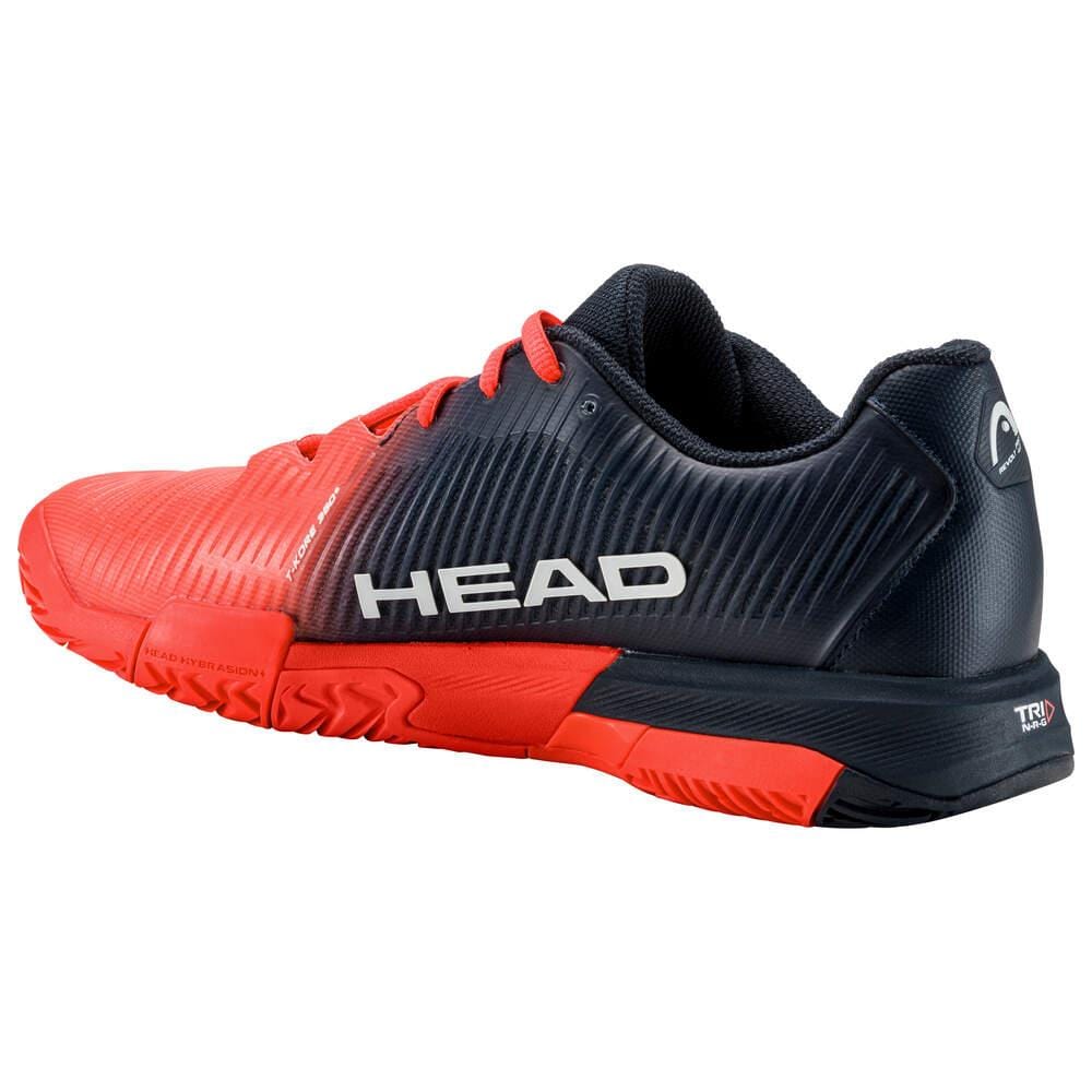 The HEAD Revolt Pro 4.0 Mens Tennis Shoes - BBFC showcase a stylish red and black design with "HEAD" branding prominently displayed on the side. Designed with advanced performance technologies, they feature a textured sole ideal for sports activities, complemented by a black back and sole that enhance the striking red upper.