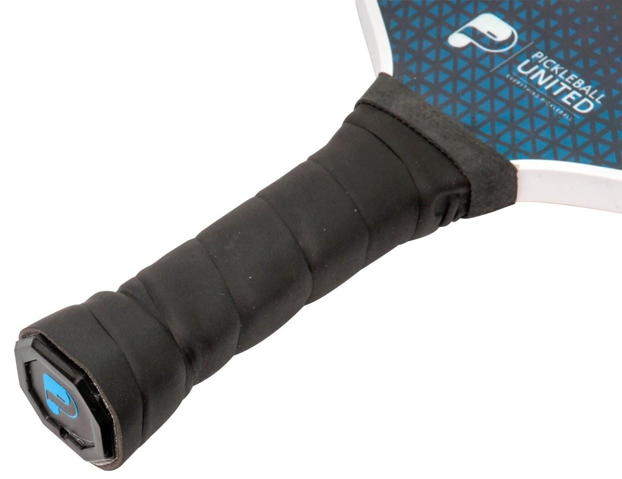Close-up of the Pickleball United Freedom Pickleball Paddle handle wrapped in black grip tape, showing part of the blue and black fiberglass surface with the Pickleball United logo.