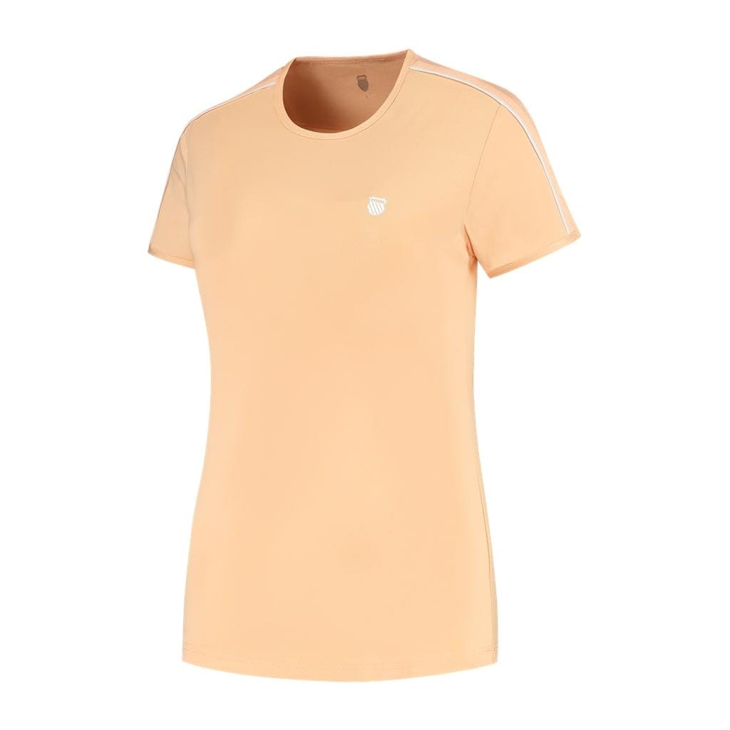 The K-Swiss Hypercourt Crew Tee 3 Women's Tennis T-Shirt in Peach Fuzz is a peach-colored, short-sleeve top featuring white shoulder stripes and a small logo on the left chest. Its sporty design and round neckline are crafted from breathable polyester for ultimate comfort, making it ideal to pair with your K-Swiss Hypercourt sneakers.