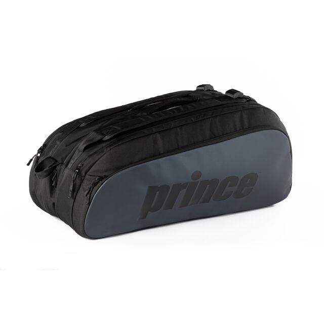 The Prince Tour 3 Comp 12 Racket Tennis Bag in black features multiple zippered compartments, including one specifically for shoes. The "Prince" logo is prominently displayed on the side in bold, dark lettering and it can efficiently hold up to 12 rackets.