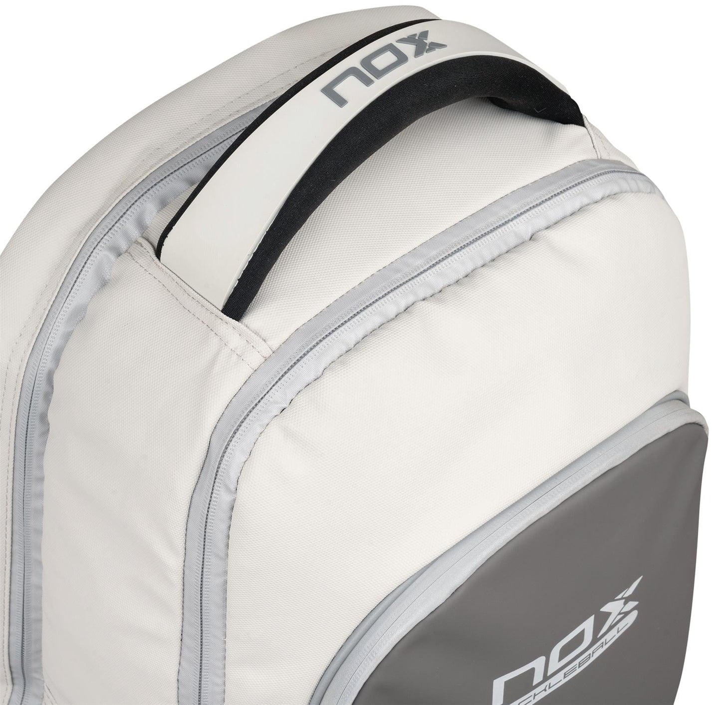 Close-up of the NOX Pro Pickleball Backpack - Cream, featuring ergonomic padded straps, a padded handle, and a zippered main compartment with the NOX logo visible on the handle and front pocket.