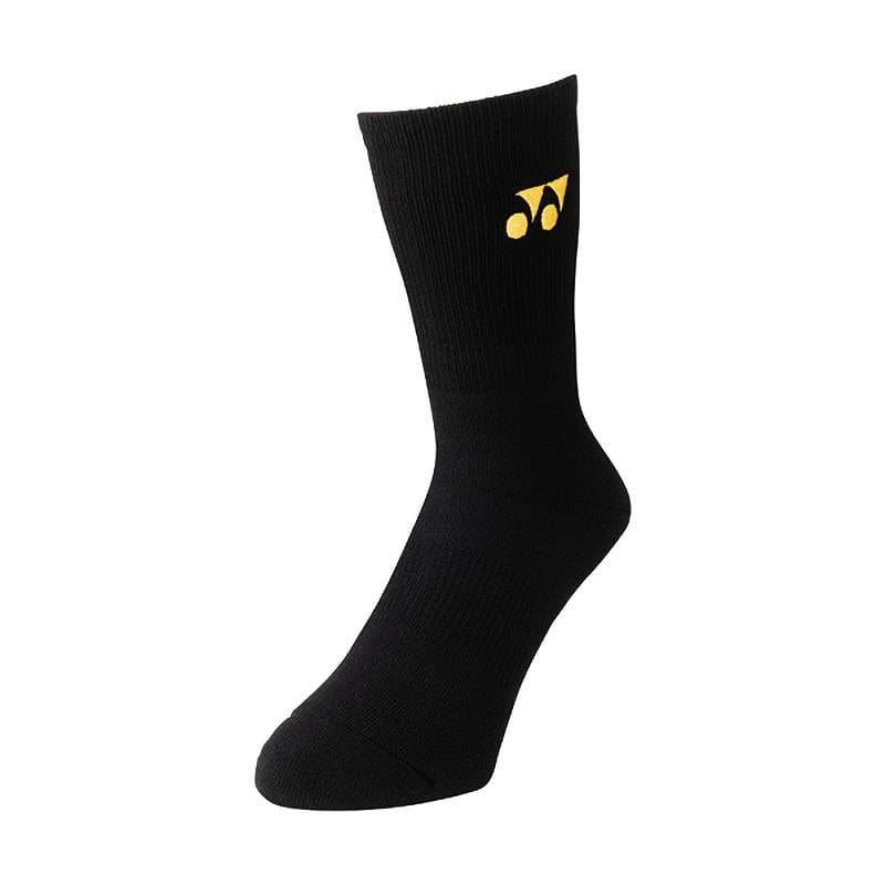 A single Yonex 19120EX 3D ERGO Crew Tennis Sock in black with a yellow logo, featuring two circular shapes and a triangular design, is known for its superior cushioning and is displayed against a plain white background.
