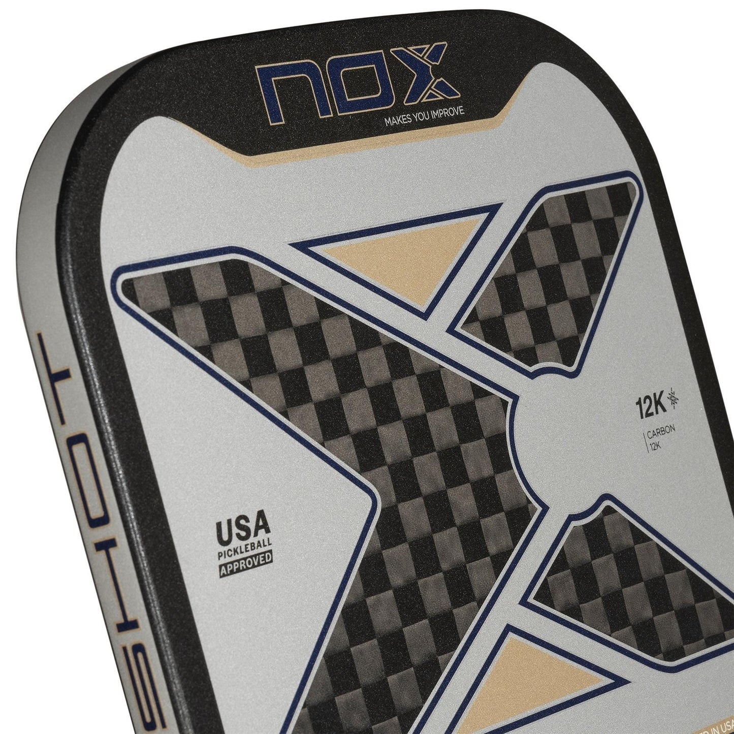 Close-up of the NOX Pro Shot Pickleball Paddle by NOX in Black/Blue, featuring a bold X design, checkered 12K carbon fiber pattern, gold accents, and text including "USA Pickleball Approved," "Makes You Improve," and "spin technology.
