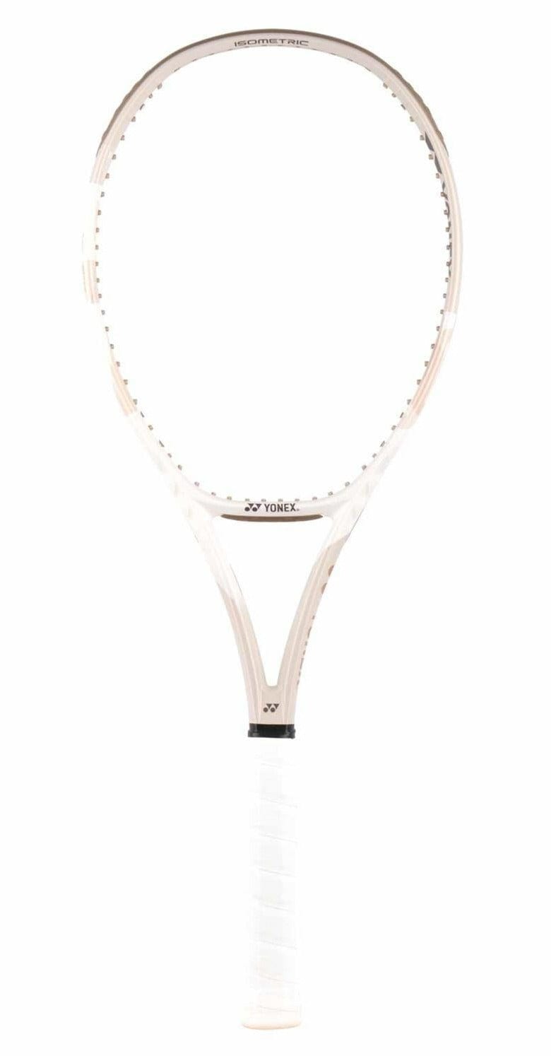 The Yonex VCORE 95 Tennis Racket in Sand Beige features a light frame and strings for spin and speed. The grip is wrapped in white tape with the Yonex logo on the neck. Its elegant design is boosted by ISOMETRIC™ technology for an enhanced playing experience.