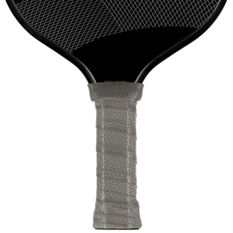 Close-up of a Lizard Skin DSP Ultra Pickleball Grip 0.8mm in Graphite Grey, showing its textured non-slip finish wrapped on the handle of a black paddle with a visible string pattern above the grip.