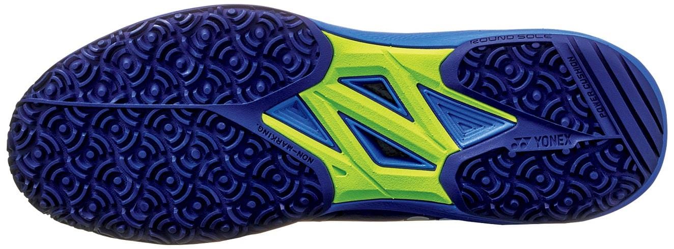 Close-up of the Yonex Power Cushion Sonicage 2025 Clay Womens Tennis Shoes sole in Mist Purple, featuring blue and neon yellow textured circular patterns for clay court grip and stability, with Yonex brand markings along the edge.