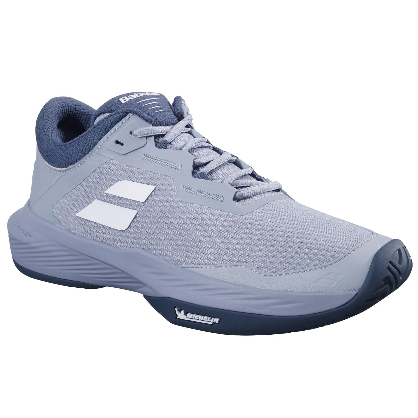 The Babolat SFX 4 All Court 2025 is a grey and white tennis shoe with a blue sole, featuring a textured mesh upper and logo details. Its low profile design and Michelin Original rubber ensure great grip, making it ideal for sports or casual wear.