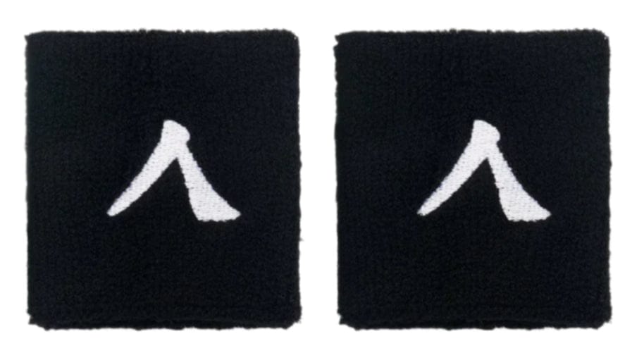 Two black fabric Kanso 7cm wristbands feature white minimalistic human figures, set on a plain white background. Made from absorbent fabric for comfort, these patches capture the simple essence of the Kanso brand.