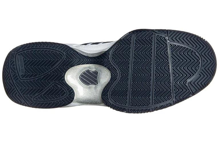 Close-up of the K-Swiss Defier RS Men's Tennis Shoes, highlighting the sole with a textured black rubber pattern featuring zigzag grooves for enhanced stability, along with a metallic silver section near the arch to ensure durability.