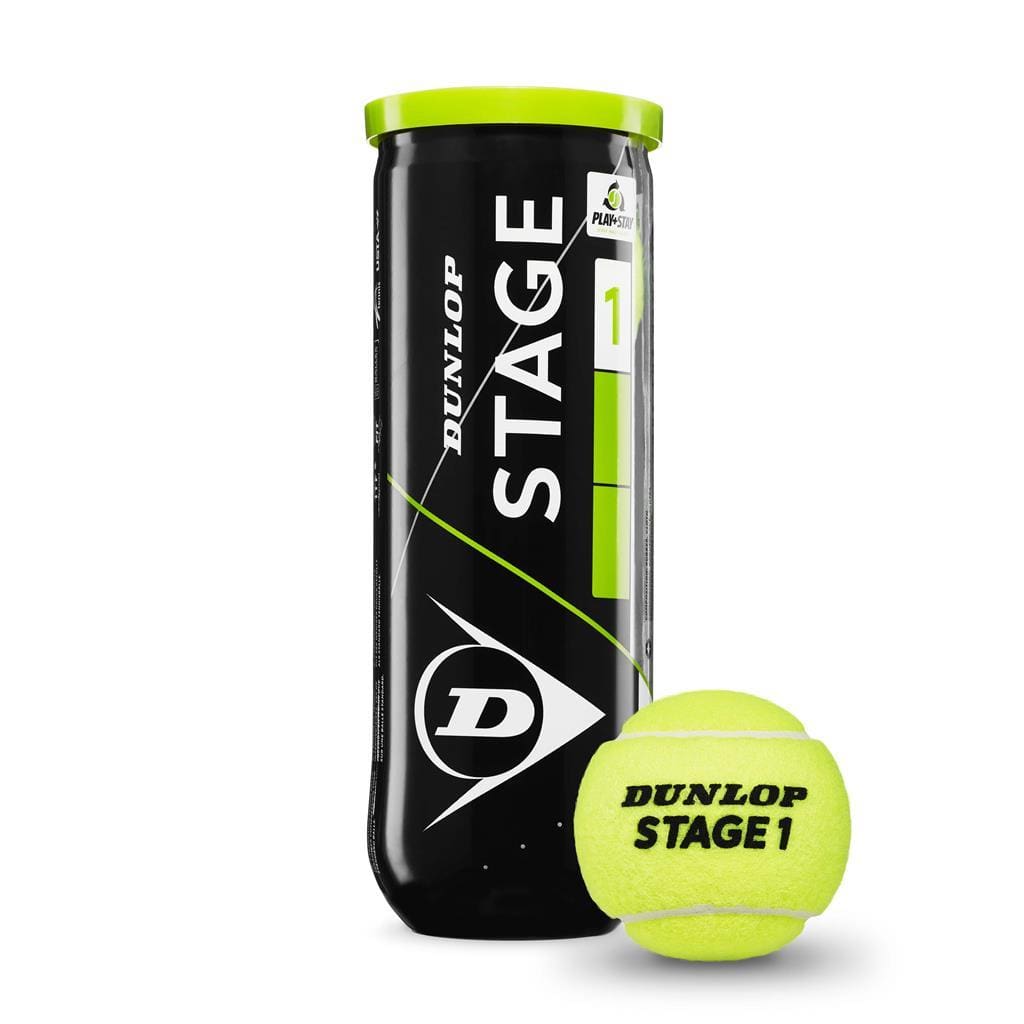 A Dunlop Stage 1 Tennis Ball - Green rests beside its black and green cylindrical tube, which prominently features the Dunlop logo and the "Stage 1" label, indicating its design for players transitioning from beginner to intermediate levels.