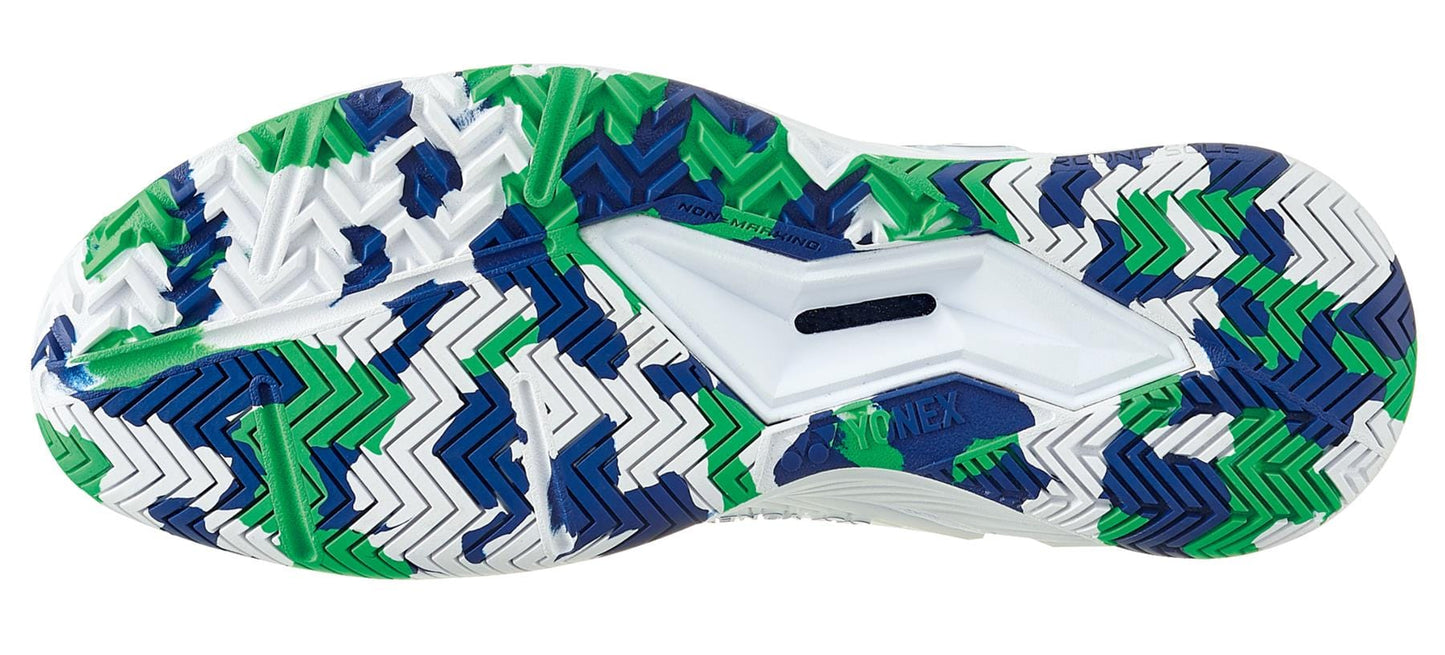 The image displays the vibrant sole of the Yonex Power Cushion Eclipsion 4 All Court Women's Tennis Shoes in White and Aloe, highlighting a chevron pattern with blue, green, and white sections. The Yonex Power Cushion design incorporates textured grooves along with a central cutout featuring the "NON-MARKING" label.