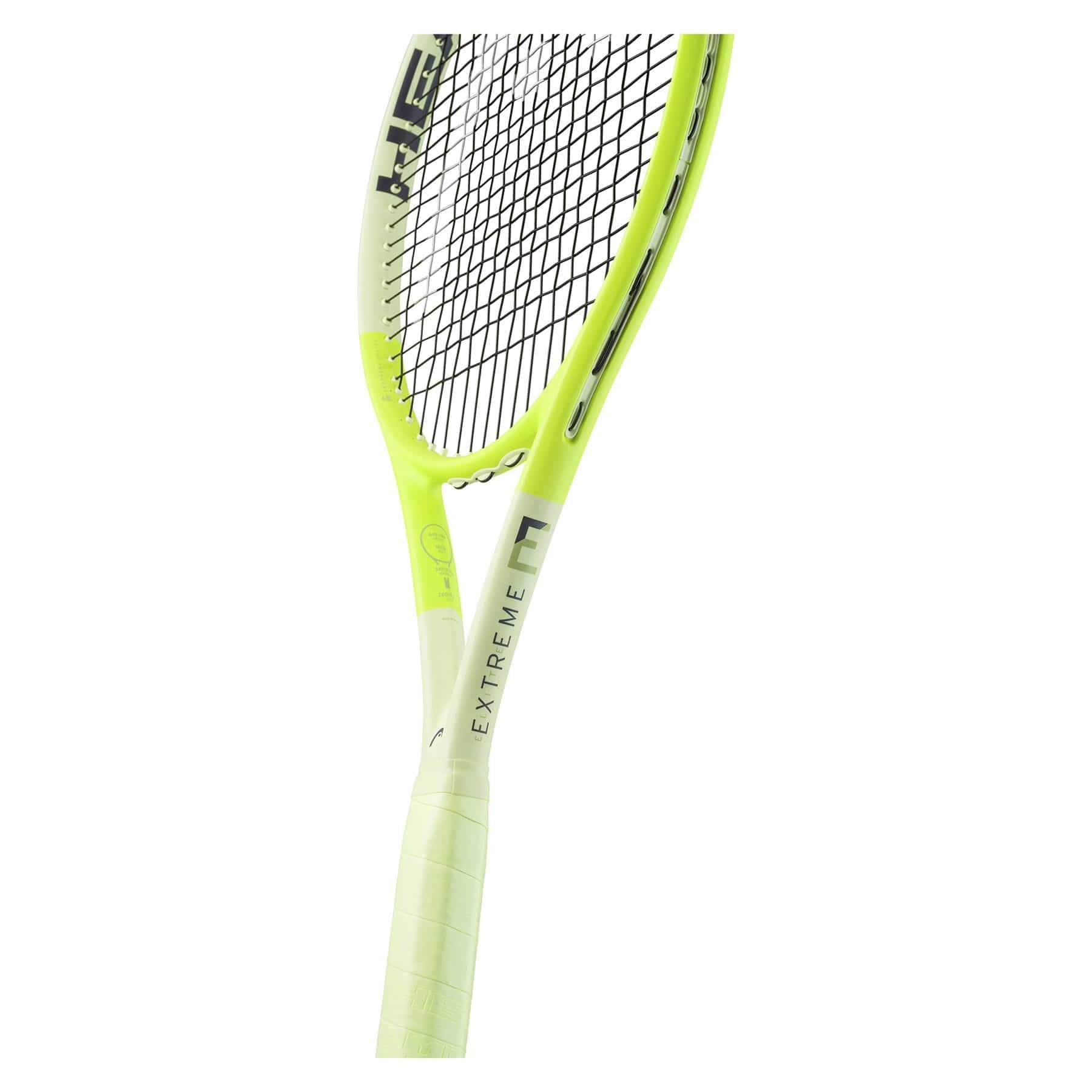 Close-up of a green tennis racket with "EXTREME" printed on the frame, showcasing its HEAD Extreme Elite 2024 design. The white-gripped handle complements the Auxetic 2.0 technology, ensuring extreme spin with tightly strung strings. The image highlights the upper handle and strings, illustrating the innovative features of this HEAD racket.