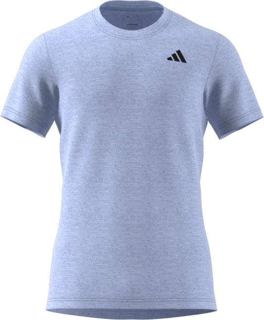 Check out the Men's Freelift Tennis T-Shirt by adidas in Blue Dawn, designed with AEROREADY technology to keep you cool. This short-sleeved tee features a subtle heather pattern and a discreet black Adidas logo on the left chest, offering an effortlessly stylish and comfortable fit.