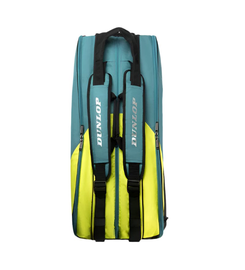 The Dunlop SX Performance 8 Racket Tennis Bag in teal, black, and yellow features ergonomic shoulder straps with the brand name "Dunlop." Its simple, functional design includes a zippered compartment and sturdy build perfect for tennis equipment.