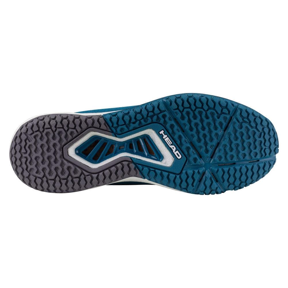 The image displays the sole of the HEAD Motion Pro Mens Pickleball Shoes - TBWH, in blue and gray with a textured tread for grip. "HEAD" appears at the center, emphasizing DynaFoam cushioning for enhanced comfort.