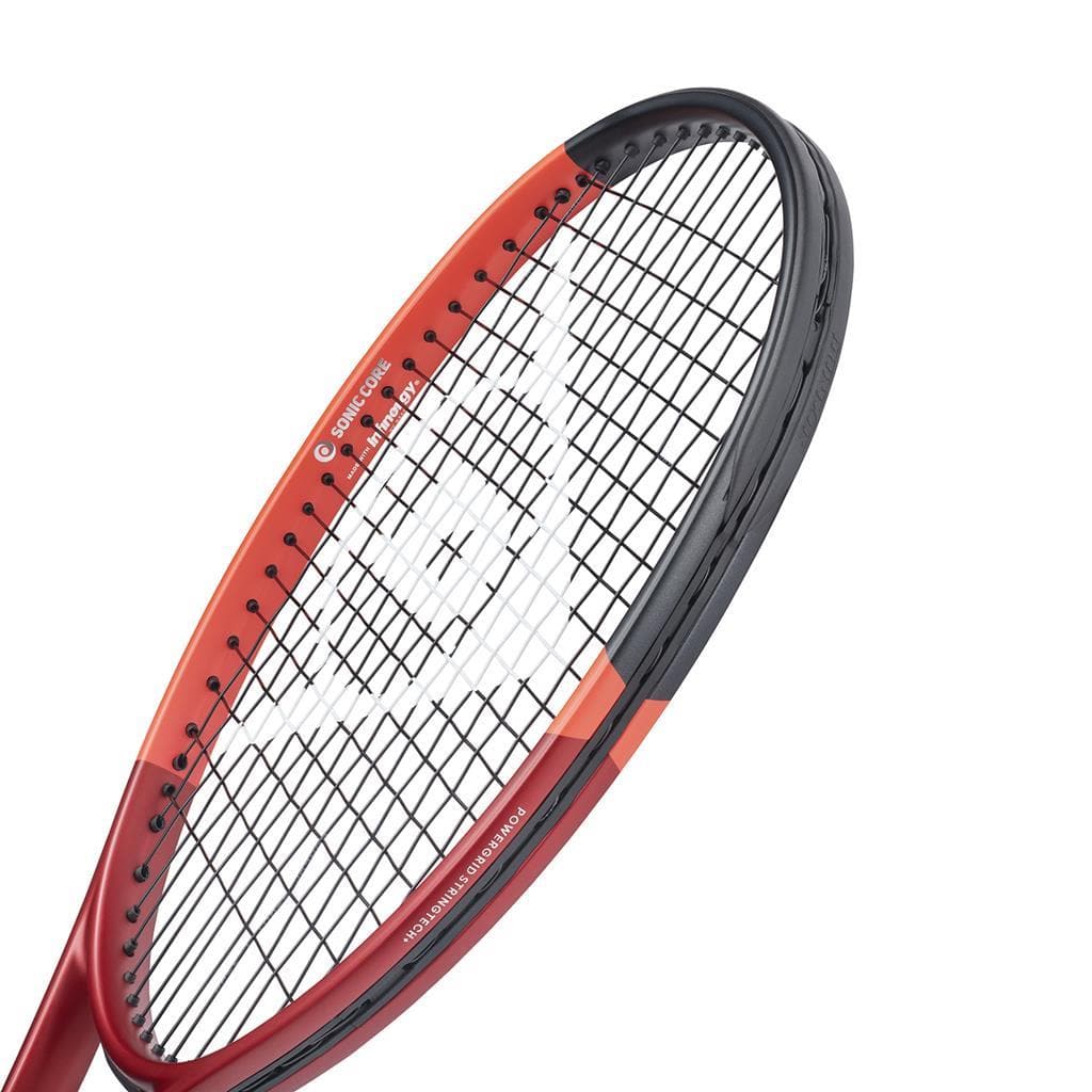 Close-up of the Dunlop CX 400 Tour 2024 Tennis Racket - Red, featuring a red and black frame. The strings display a white pattern forming a logo, emphasizing its spin potential. The brand name "Dunlop" is visible on the frame, and the image highlights the enhanced racket feel at the head and strings.