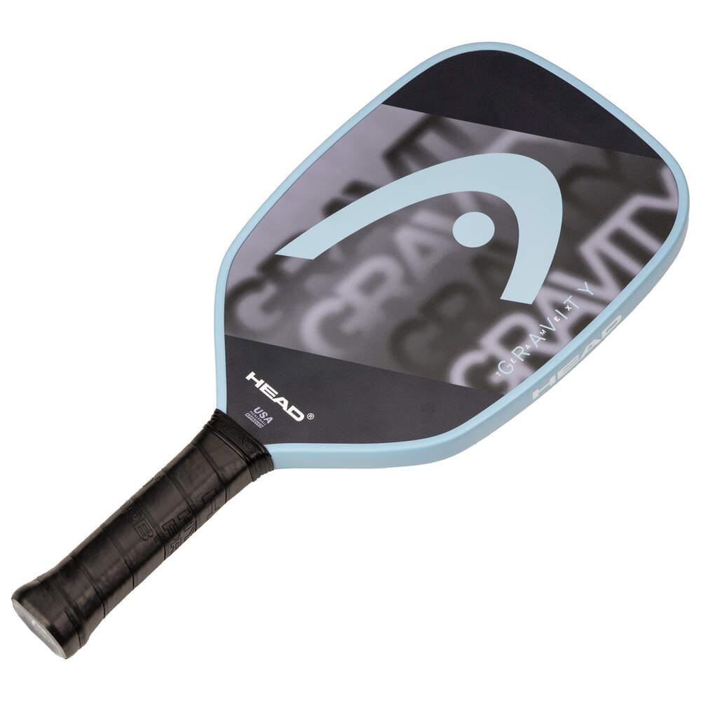 The HEAD Gravity Team EX 2025 Pickleball Paddle by HEAD features a black face, large blue logo, blue edge, black grip handle, and "GRAVITY" detail. Designed for excellent control and spin potential.
